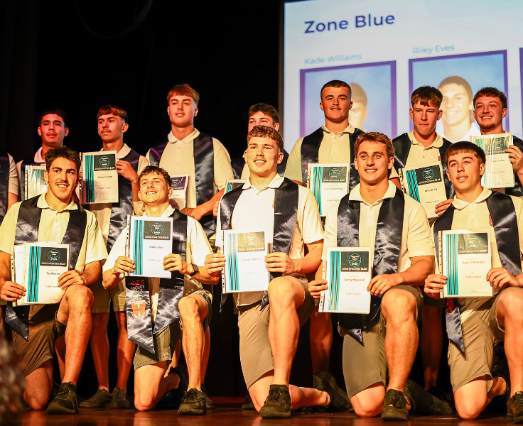 a group of students all displaying awards