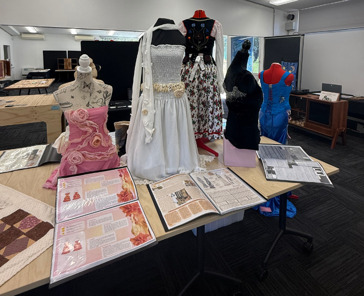 a display of dresses created by students
