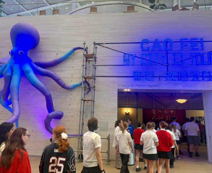 students on an excursion walking through a warehouse